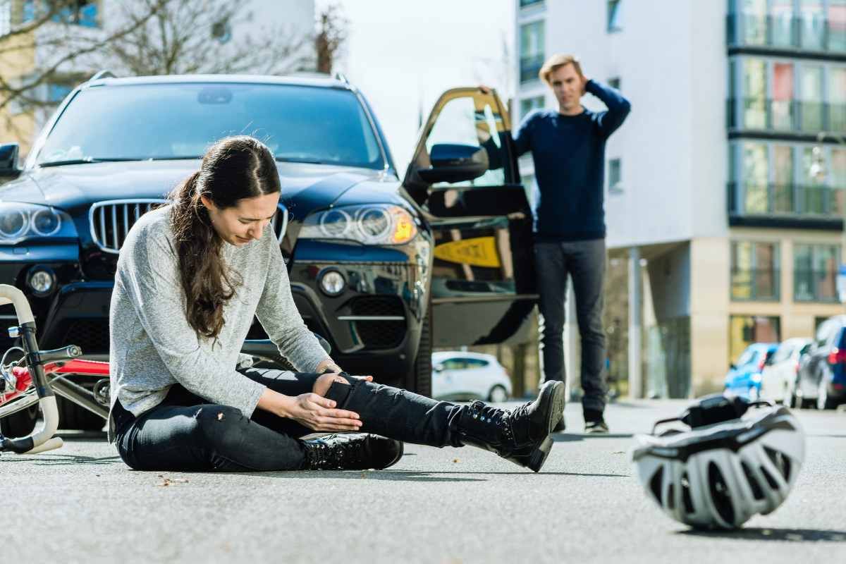 Woman sitting on road injured after being hit by a rideshare vehicle in San Diego