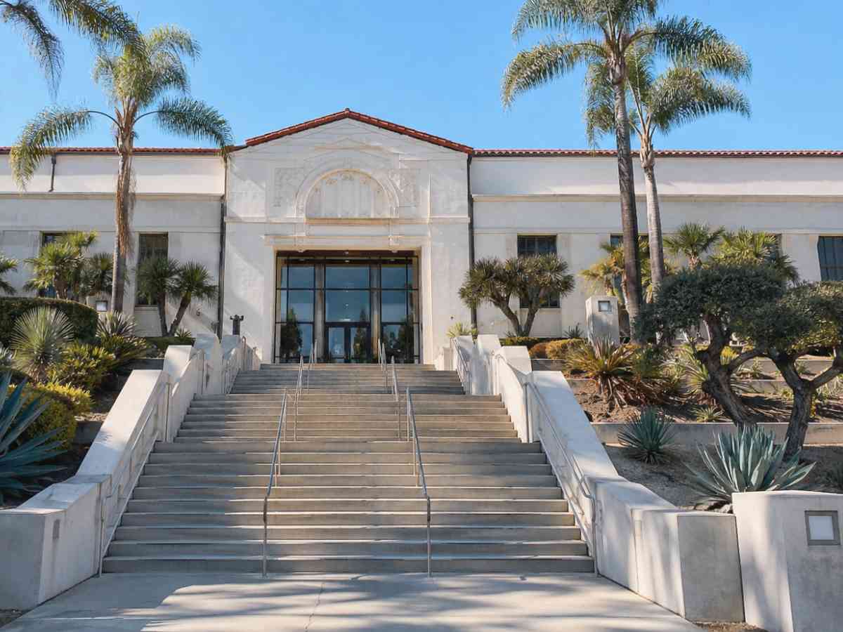California Superior Court building exterior with front steps, Spanish Colonial Revival architecture, palm trees, and drought-tolerant landscaping