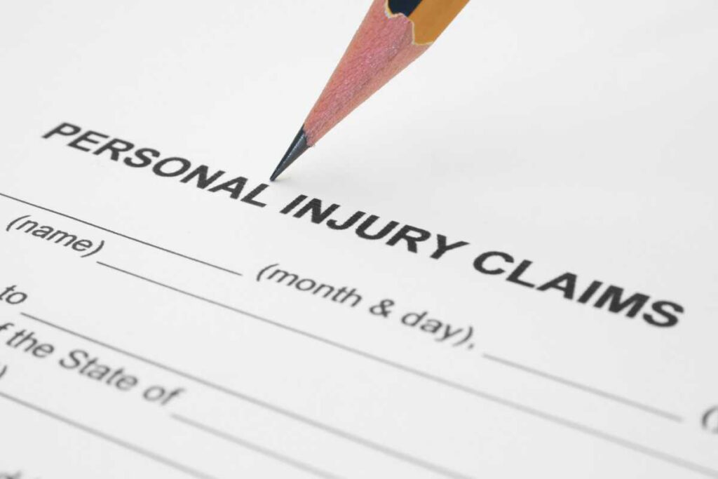 encil pointing to a personal injury claims form, representing the first steps in filing and documenting evidence for San Diego accident cases.