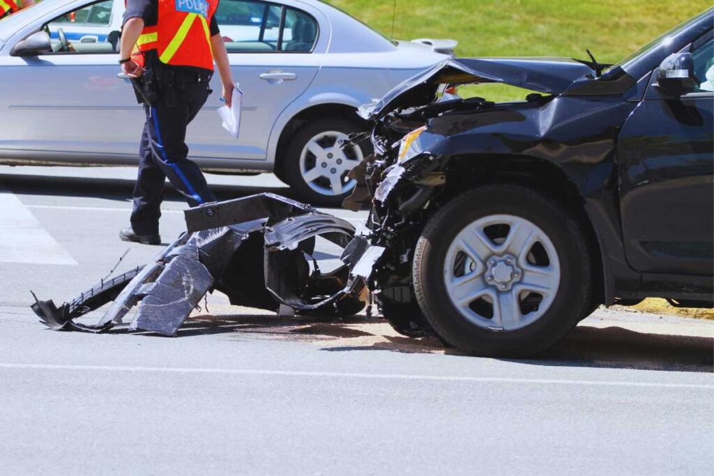 Front-end damage from a rideshare accident with police documenting the scene, showing how collision evidence and officer reports support San Diego injury claims.